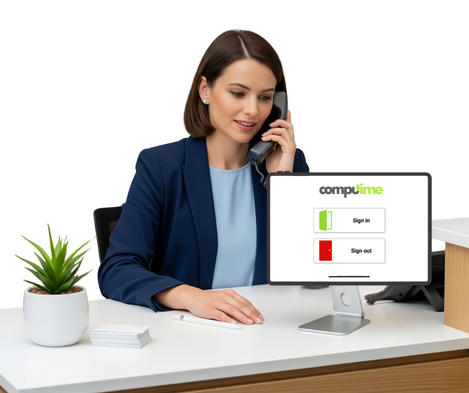 School receptionist signing in a visitor using Computime visitor management software at the front desk