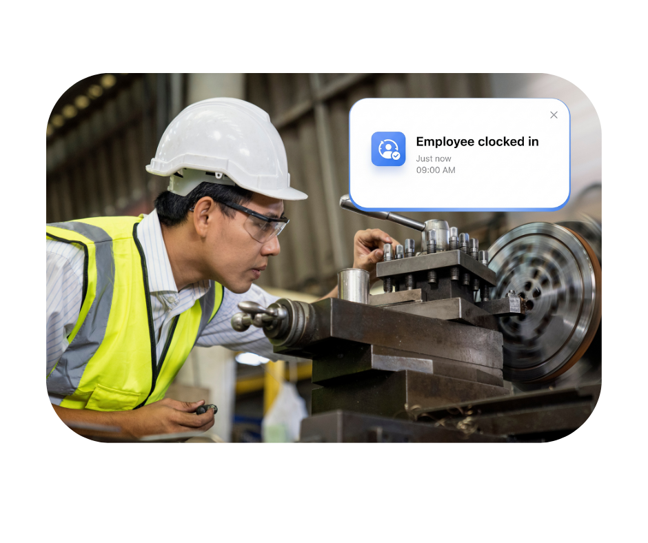 Manufacturing worker clocking in using Computime time and attendance software on the factory floor